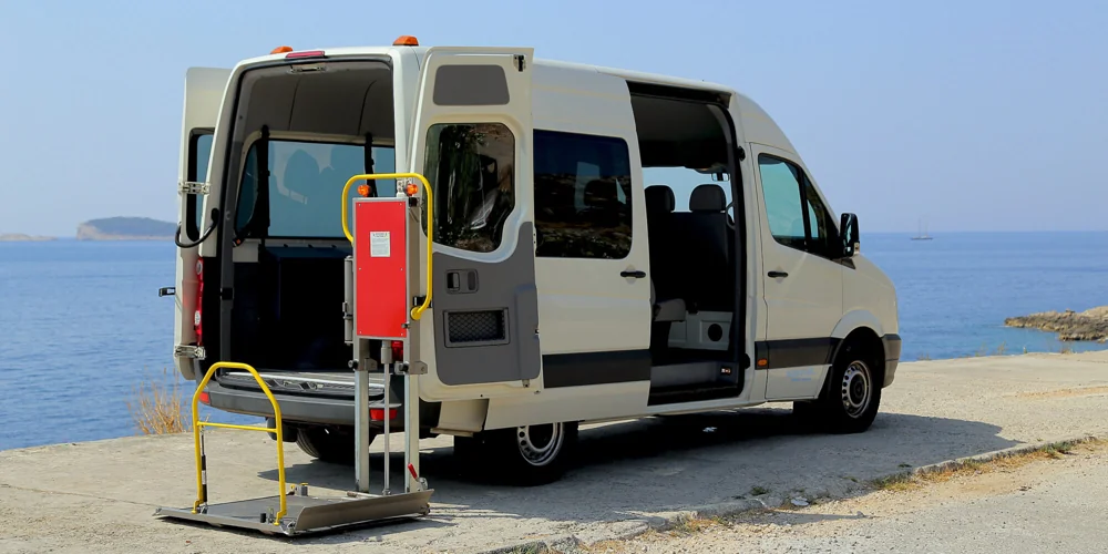 Side view of the adapted minivan with wheelchair lift lowered